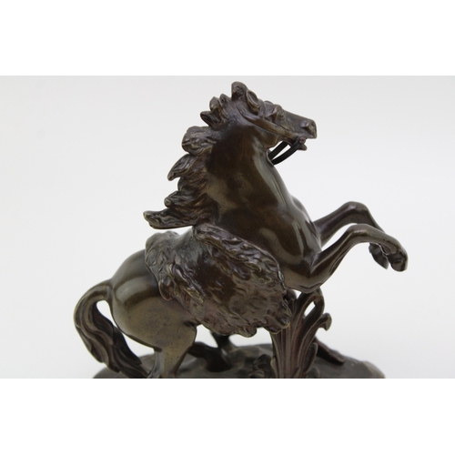9 - A pair of 19th century bronzed spelter figures 'Horse Restrained by a Groom', modelled after the fam... 