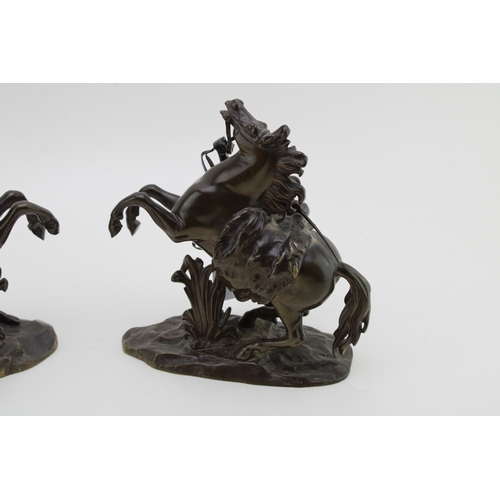 9 - A pair of 19th century bronzed spelter figures 'Horse Restrained by a Groom', modelled after the fam... 