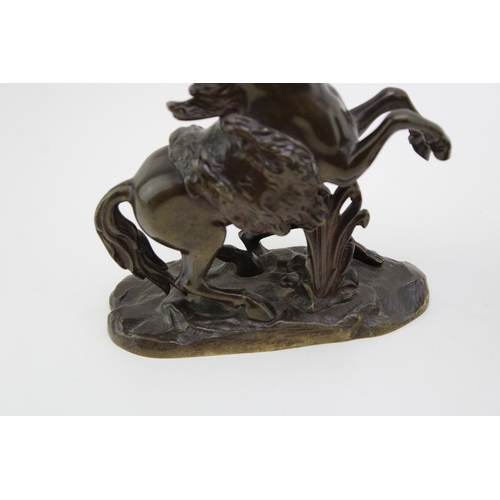 9 - A pair of 19th century bronzed spelter figures 'Horse Restrained by a Groom', modelled after the fam... 