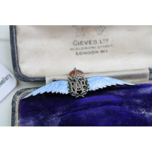 258 - A silver and enamel RAF sweetheart brooch, with pale blue enamel wings, red crown and green laurel l... 