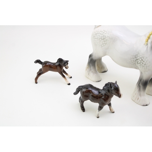 312 - Beswick horses to include a grey shire horse, a large shire foal in brown and others (Qty).