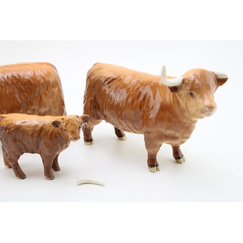 314 - A Beswick Highland Cattle family to include a bull, a cow (horn af) and calf (3).