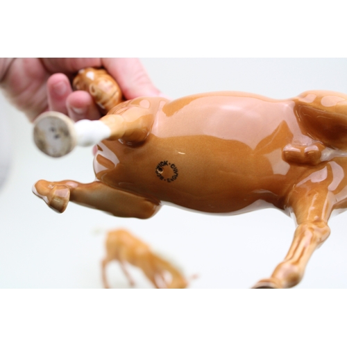 317 - Beswick palomino horses to include a leg tucked horse and three foals (4).