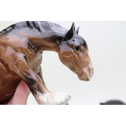 321 - Beswick horses to include a brown grazing shire, a mare facing right, an 818 shire and a large shire... 