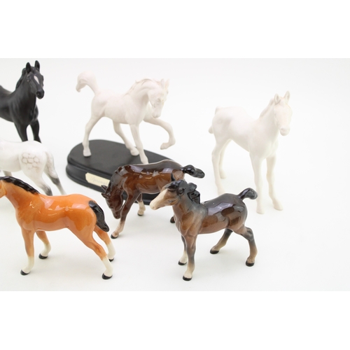 332 - A collection of Beswick foals (7).