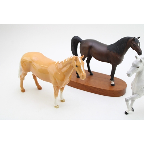 339 - Beswick to include a grey prancing arab, a matte brown arab xayal and a palomino huntsman's horse (3... 