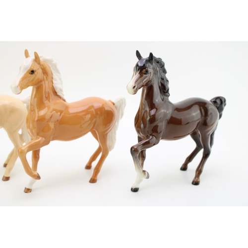 340 - Beswick prancing arabs to include a light palomino colourway, a darker palomino colourway and a brow... 