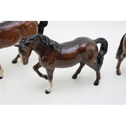 346 - Beswick brown stocky jogging mare with a huntsman's horse and one other (3).