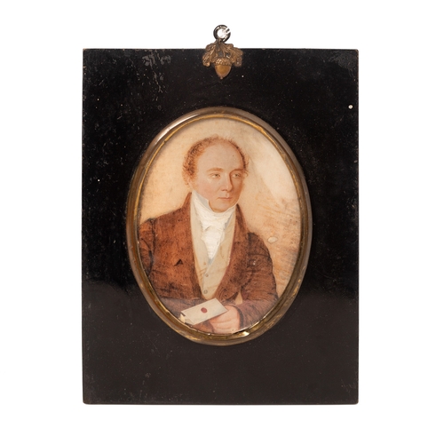 11 - A mid 19th century portrait miniature of a gentleman holding a letter, of oval form delicately paint... 