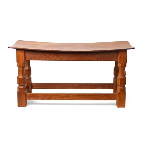 16 - Robert 'Mouseman' Thompson: an oak coffee table, the curved adzed rectangular top on four octagonal ... 