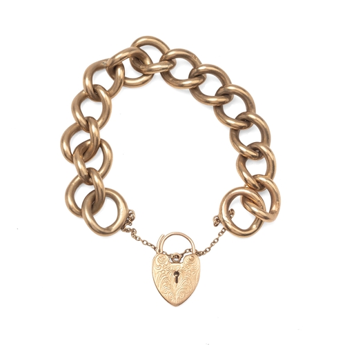 A 9ct gold oversized curb link bracelet with engraved heart shaped padlock clasp, total weight 70.0g.