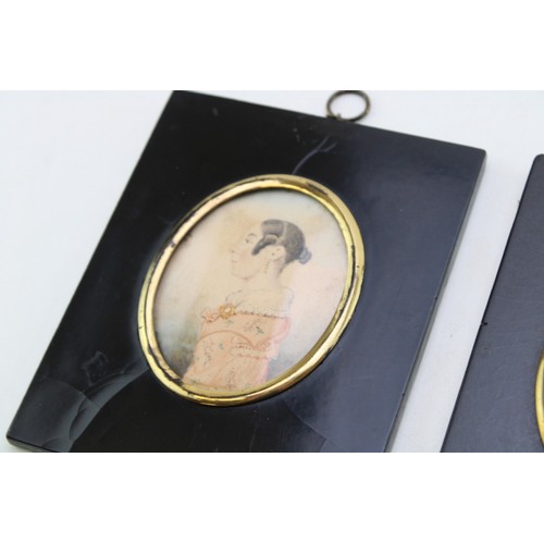 13 - A pair of mid 19th century portrait miniatures on paper of two ladies of fashion, each 8 by 6.5cm, g... 