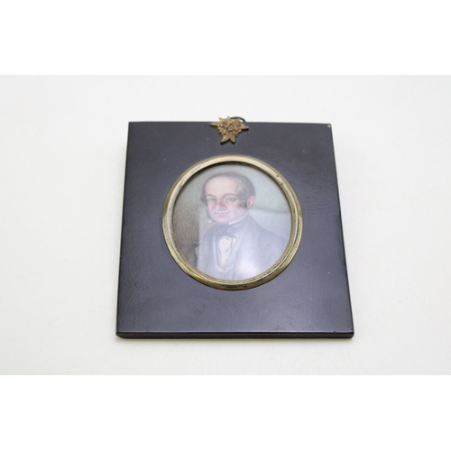 10 - A mid-Victorian portrait miniature of a gentleman, of oval form, delicately painted on ivory, appare... 