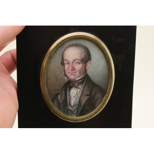 10 - A mid-Victorian portrait miniature of a gentleman, of oval form, delicately painted on ivory, appare... 