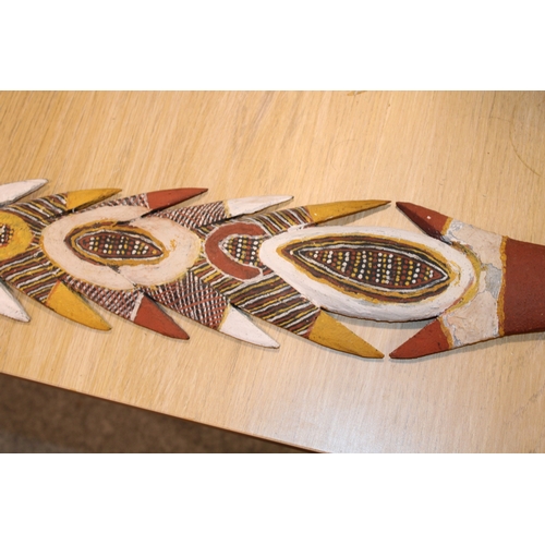 28 - An Australian Aboriginal carved wooden spear head painted with natural ochre paint decoration unsign... 