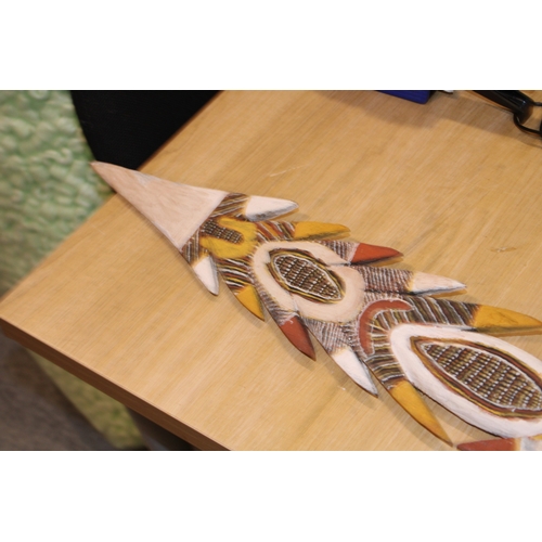 28 - An Australian Aboriginal carved wooden spear head painted with natural ochre paint decoration unsign... 