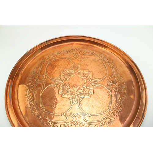 4 - A Keswick School of Industrial Arts, Arts & Crafts circular copper charger, the central repoussé pan... 