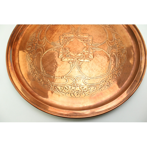 4 - A Keswick School of Industrial Arts, Arts & Crafts circular copper charger, the central repoussé pan... 
