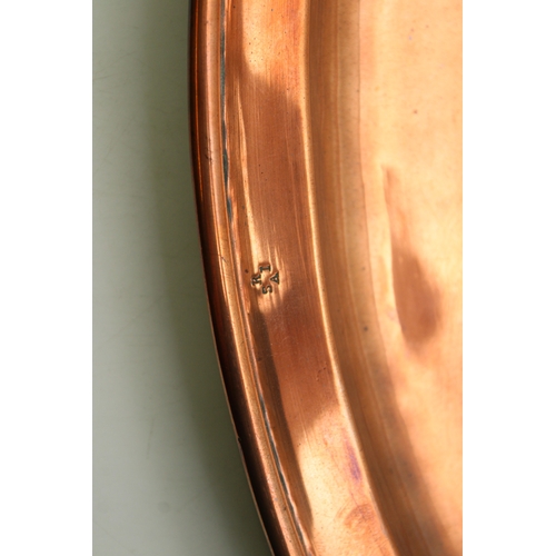 4 - A Keswick School of Industrial Arts, Arts & Crafts circular copper charger, the central repoussé pan... 