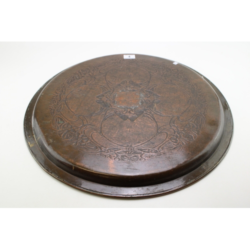 4 - A Keswick School of Industrial Arts, Arts & Crafts circular copper charger, the central repoussé pan... 