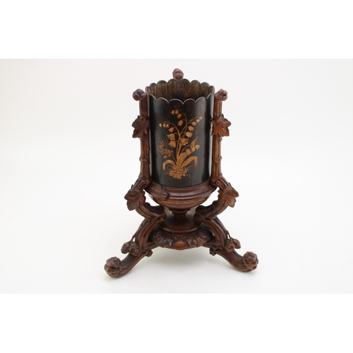 7 - A late 19th / early 20th century Black Forest wooden cylindrical vase, raised on carved tripod base ... 