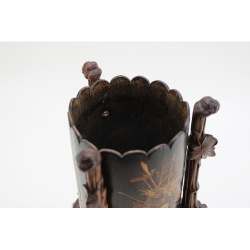7 - A late 19th / early 20th century Black Forest wooden cylindrical vase, raised on carved tripod base ... 