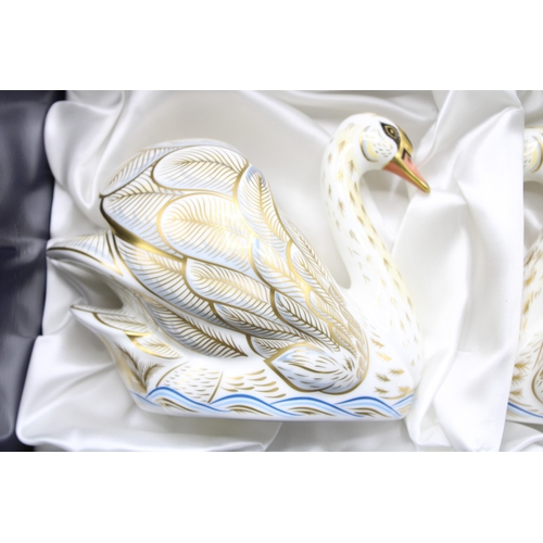 1 - A boxed pair of Royal Crown Derby paperweights, The Royal Swans 
