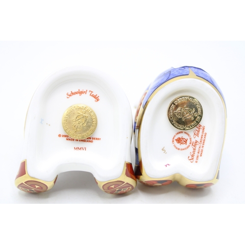 39 - A pair of Royal Crown Derby paperweights, Schoolboy and Schoolgirl Teddy, gold stoppers, red Royal p... 