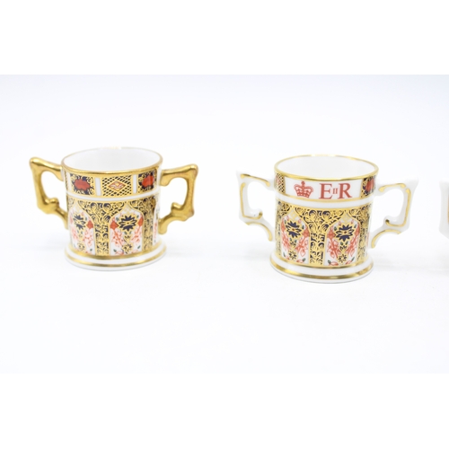 53 - Royal Crown Derby miniature 1128 imari loving cups to include a Diamond Jubilee example, 60 Years An... 