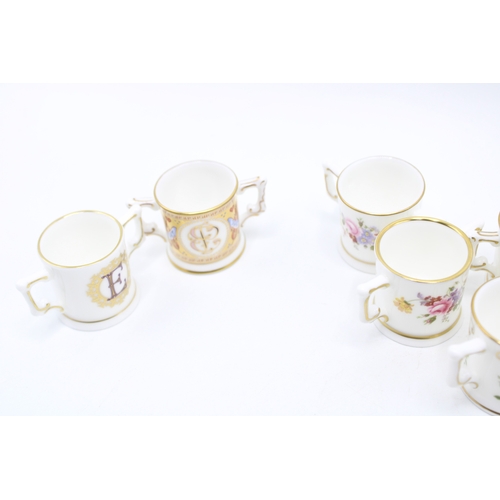 54 - A collection of Royal Crown Derby miniature loving cups to include Prince George, Princess Charlotte... 