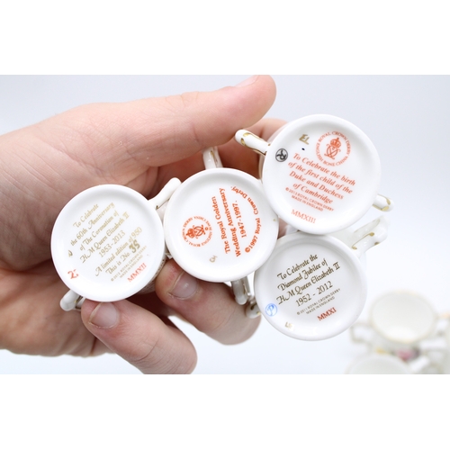 54 - A collection of Royal Crown Derby miniature loving cups to include Prince George, Princess Charlotte... 