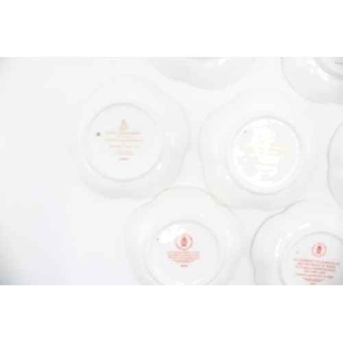 55 - Boxed Royal Crown Derby trays to include a Centenary of World War One five petal example, a Golden W... 