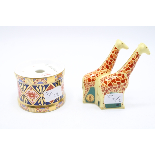 59 - Two boxed Royal Crown Derby paperweights to include a pair of giraffes and a toy drum with drumstick... 
