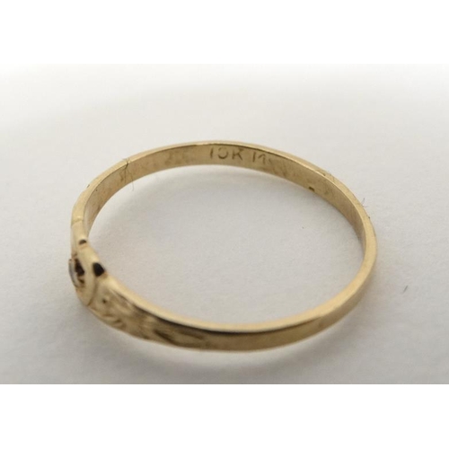 1016 - A child's 10k gold ring set with central diamond