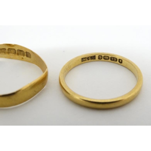 1025 - 4 various rings to include 3 22ct gold wedding bands and a 9ct gold ring (4)