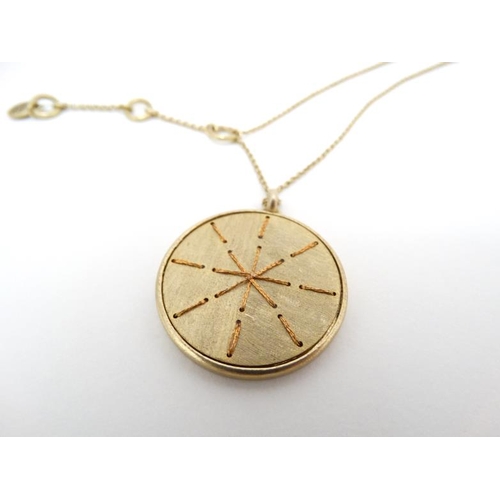 1034 - Sigrid Oslen : A gilt metal necklace and pendant by Sigrid Olsen. The pendant approx. 1 ¼'' diameter