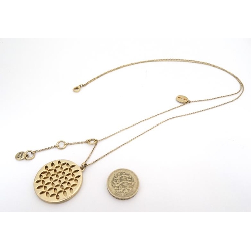 1034 - Sigrid Oslen : A gilt metal necklace and pendant by Sigrid Olsen. The pendant approx. 1 ¼'' diameter