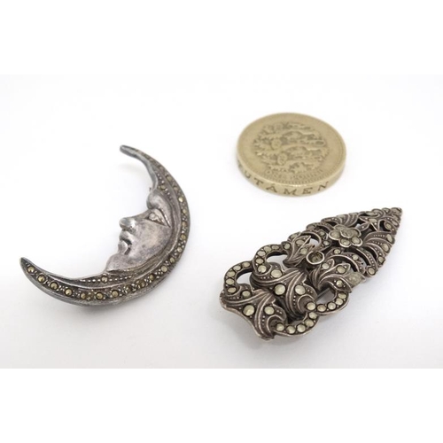 1038 - A .925 silver brooch formed as man in the moon set with marcasite decoration together with a silver ... 