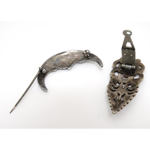 1038 - A .925 silver brooch formed as man in the moon set with marcasite decoration together with a silver ... 