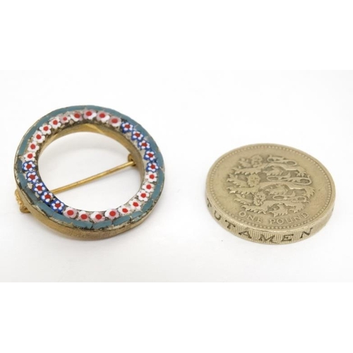 1043 - Micromosaic: A gilt metal brooch of circular form with band of micro mosaic decoration. Marked 'Ital... 