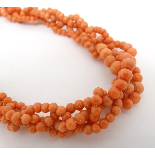 1044 - A vintage necklace of graduated coral beads. Approx 18'' long