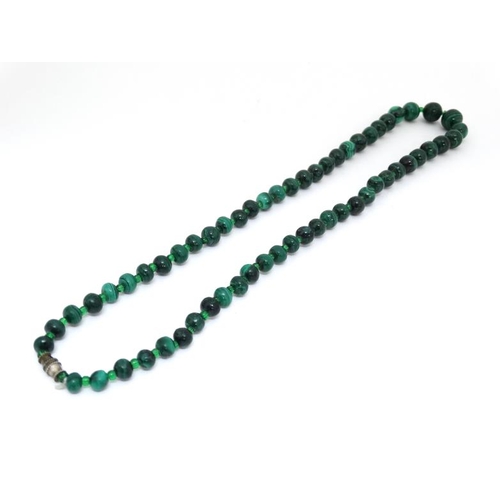 1049 - A vintage necklace of graduated malachite beads approx. 22'' long