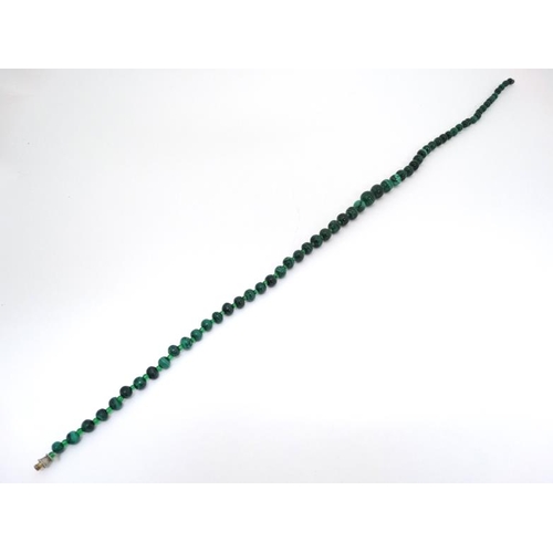 1049 - A vintage necklace of graduated malachite beads approx. 22'' long