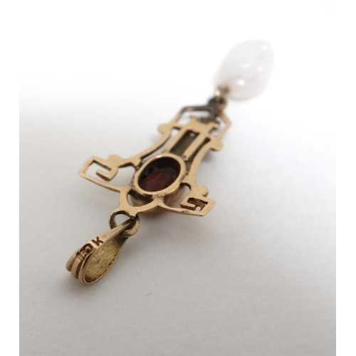 1053 - A 10k gold pedant set with red stone and white stone drop. 1 ¼'' long