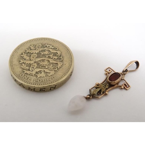 1053 - A 10k gold pedant set with red stone and white stone drop. 1 ¼'' long