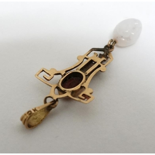 1053 - A 10k gold pedant set with red stone and white stone drop. 1 ¼'' long