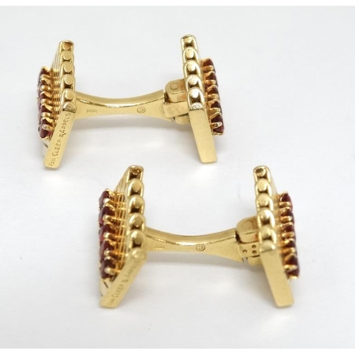 1054 - Van Cleef & Arpels : A pair of 18ct gold cufflinks with chevron design set with rows of rubies. Numb... 