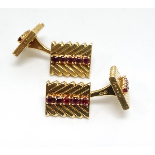 1054 - Van Cleef & Arpels : A pair of 18ct gold cufflinks with chevron design set with rows of rubies. Numb... 