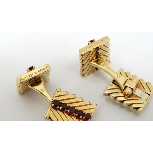 1054 - Van Cleef & Arpels : A pair of 18ct gold cufflinks with chevron design set with rows of rubies. Numb... 