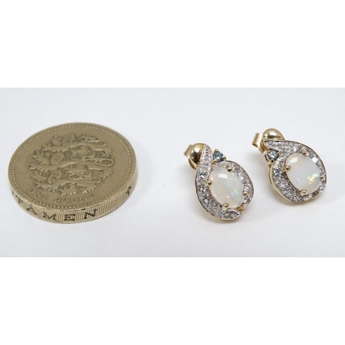 1057 - A pair of 9ct gold earrings set with opals, white stones and green stone. Approx. ½'' long